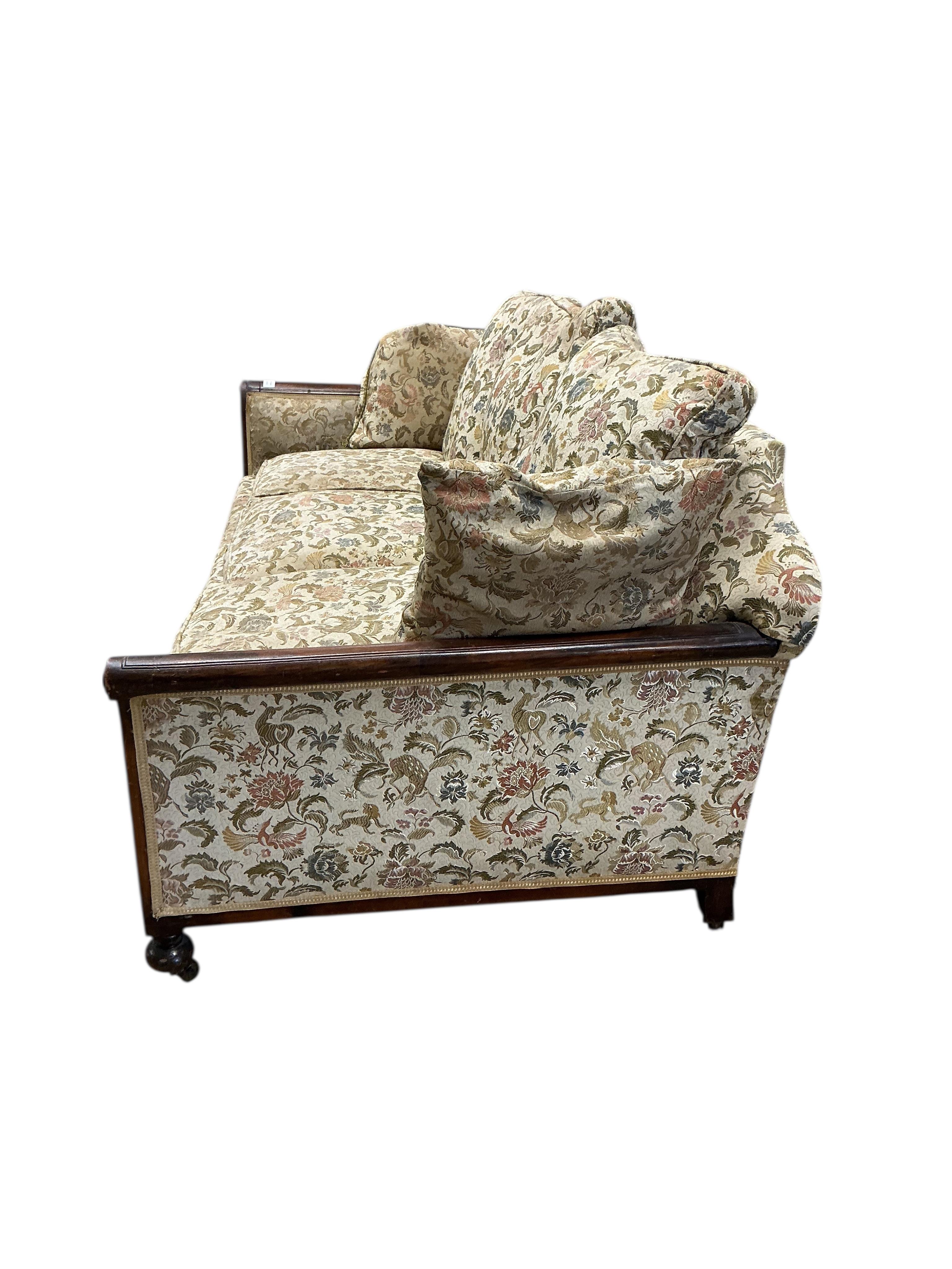 An early 20th century mahogany bergere settee, now upholstered, width 196cm, depth 92cm, height 84cm